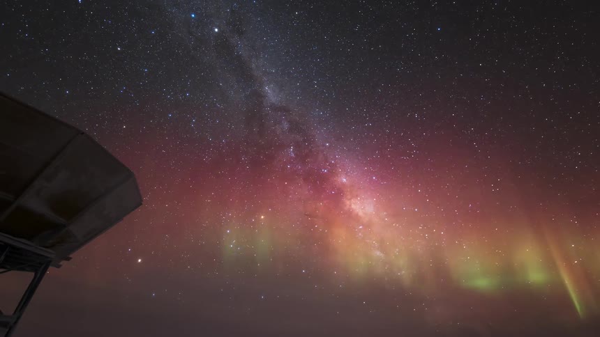 An aurora forms in the night sky