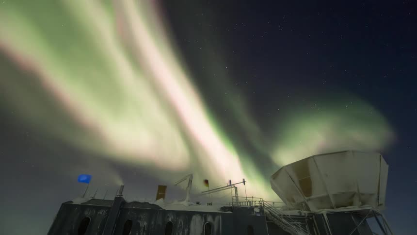 observatory at the south pole with views of the night sky with the Aurora Australis