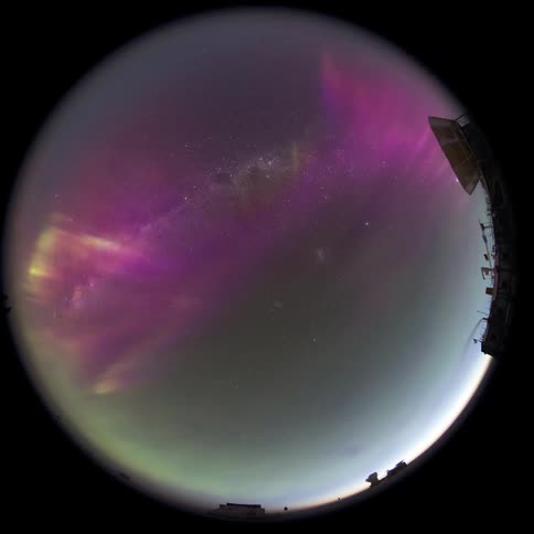 fisheye view of a camera with the purple Aurora Australis