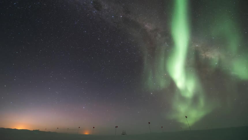 Skyscape at the south pole with a view of the Aurora Australis at night
