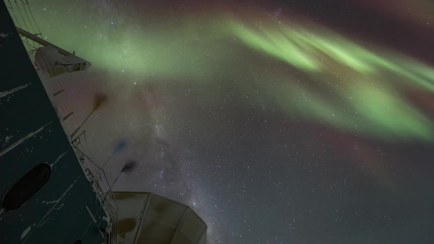 Upward view of night sky with Aurora Australis