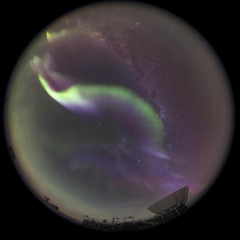 fisheye view of a camera pointed at the sky with the Aurora Australis