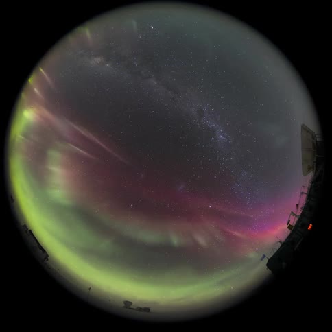 fisheye view of the sky with nebula and Aurora Australis at night