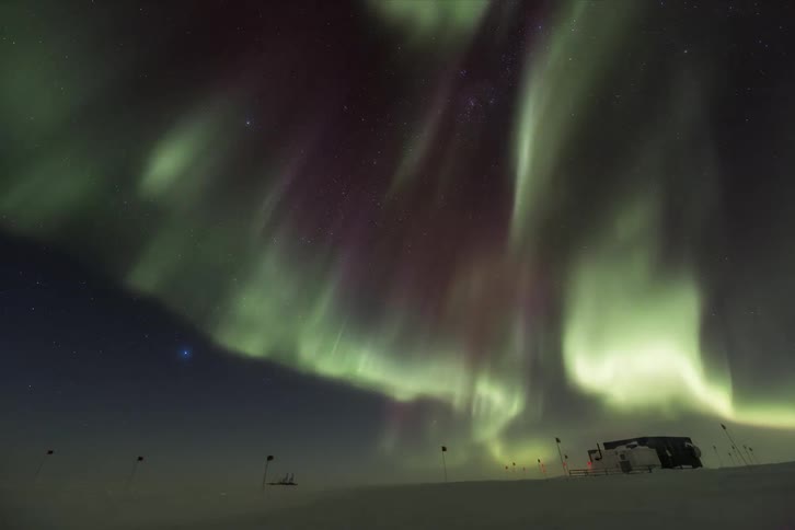 Aurora Australis over a research station at night
