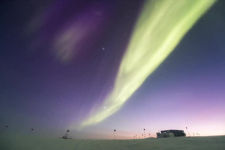 Aurora Australis shining above a research station