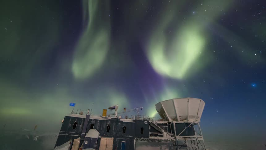 South Pole with the scientific station with a view of the sky with the Aurora Australis at night