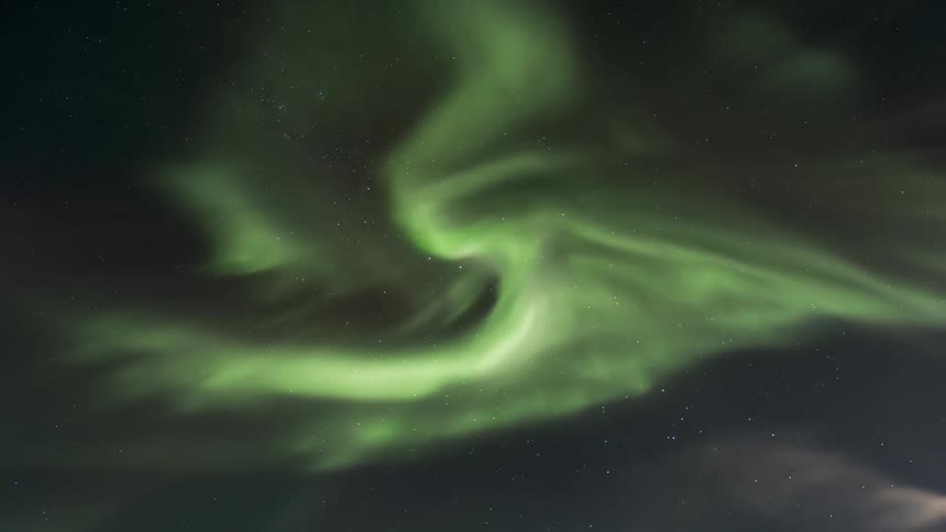 The green Aurora Australis flashes in the sky