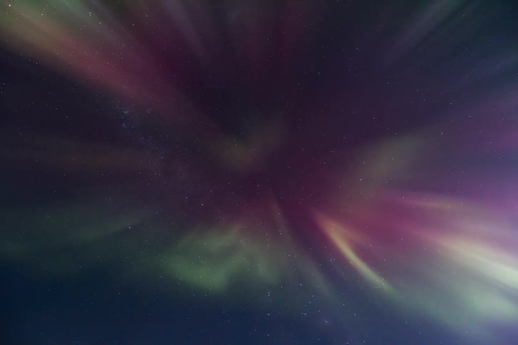 A view of Aurora Australis with green and pink colors