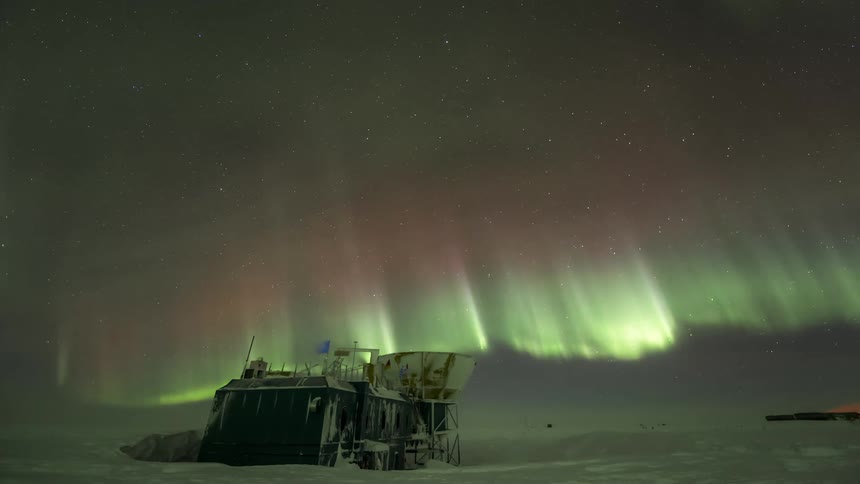 A research building in the snow under the Aurora Australis