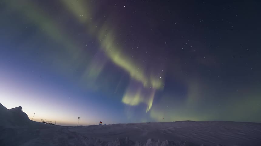 The Aurora Australis shine over the landscape