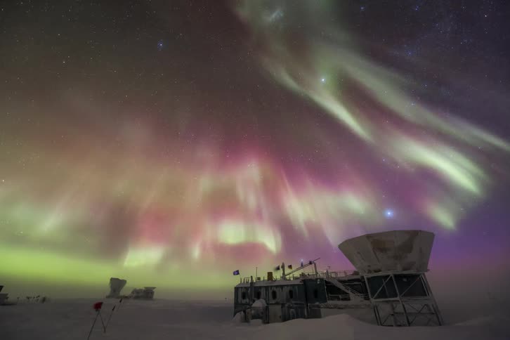 Aurora Australis shining above a research station