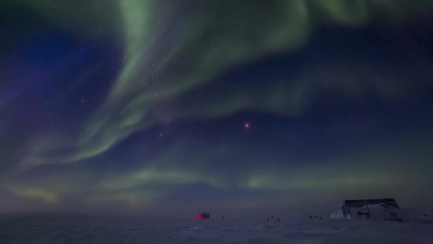 Landscape in a snowcovered polar region location and a night sky with Aurora Australis
