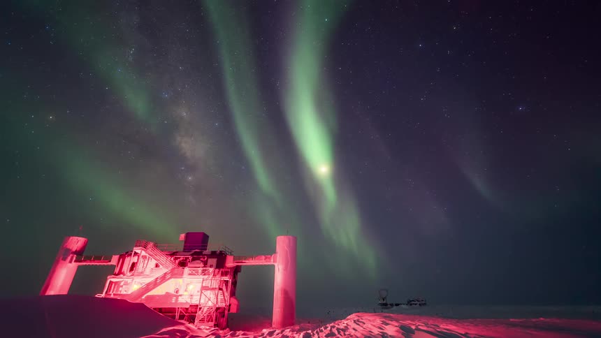 Observatory at the south pole at night with the sky with Aurora Australis