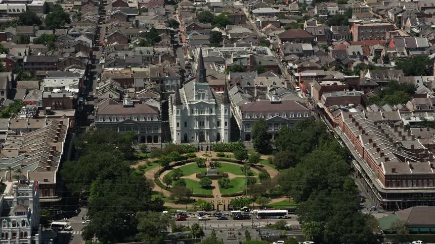 Large buildings surround a small city park