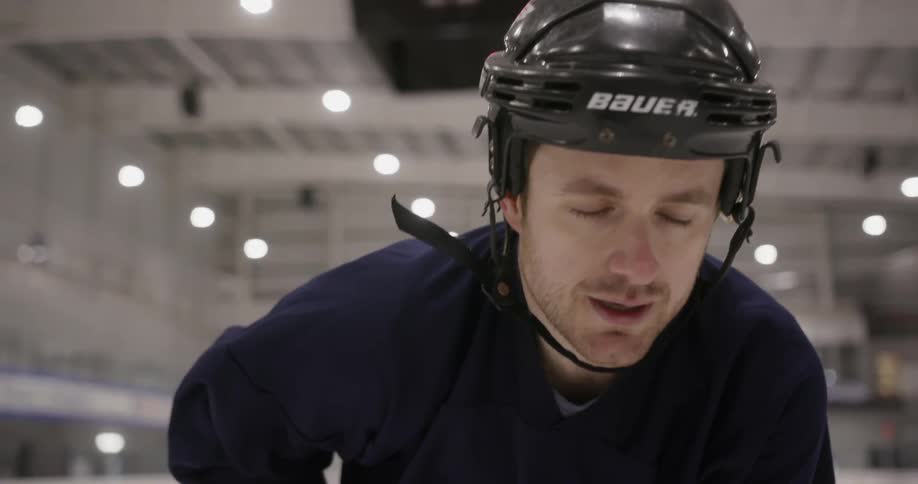A hockey player skates on the ice