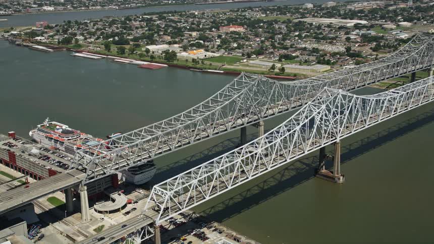 Aerial panorama of two bridges over a canal connecting an urban city