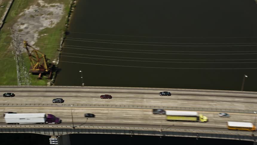 Aerial of a bridge over the river in a rural town