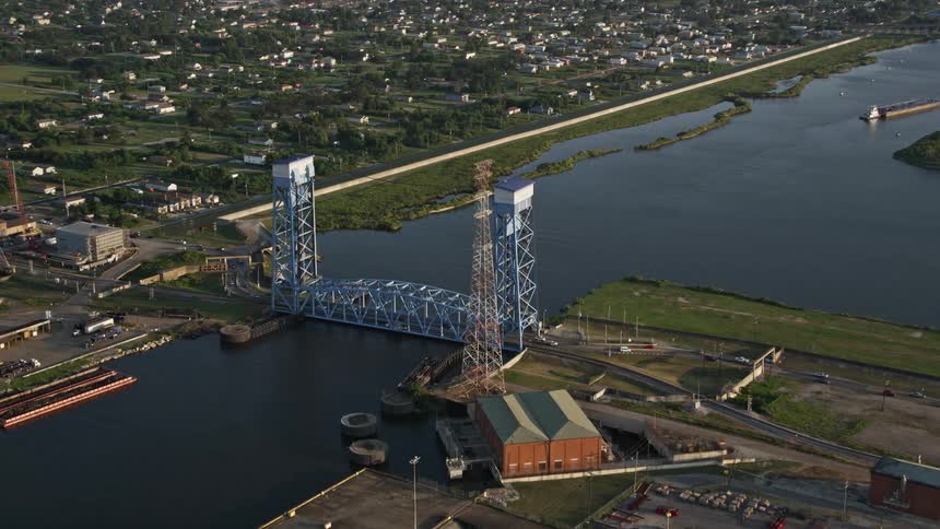 Traffic crosses a city bridge over a river