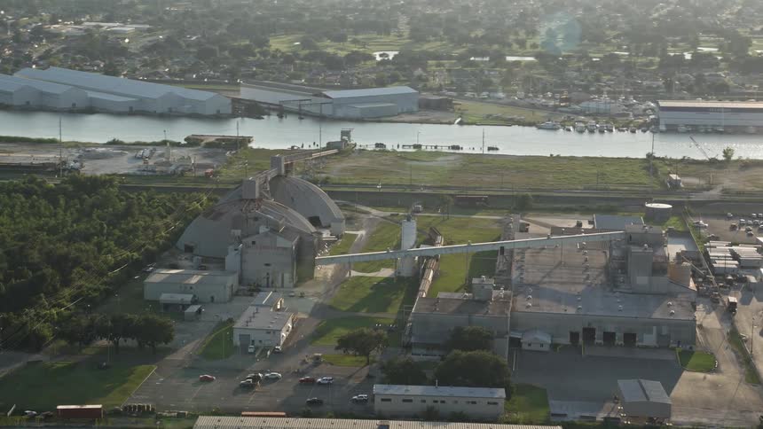 Aerial of an industrial factory in a suburban neighborhood