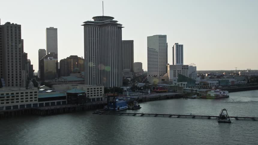 Skyline of a port with ships docked in the urban city during sunset