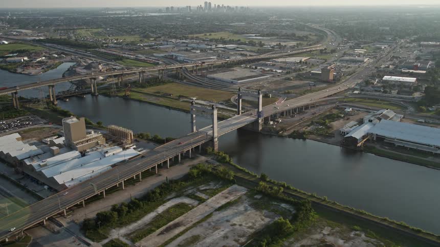Traffic crosses a city bridge over a river