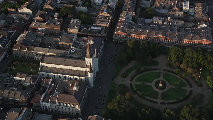 Aerial panorama of a cathedral in the middle of a city and in front of a public square