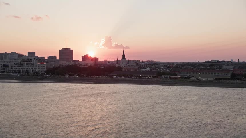 Skyline of a coastal city at dawn