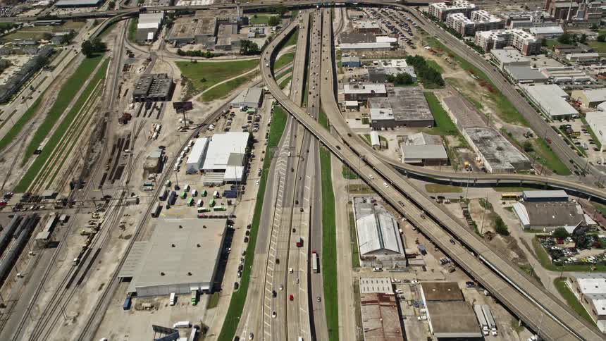 Aerial of busy urban city highways during daytime