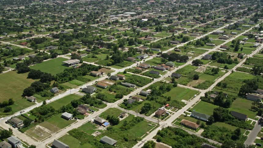 A suburban area with trees and roads