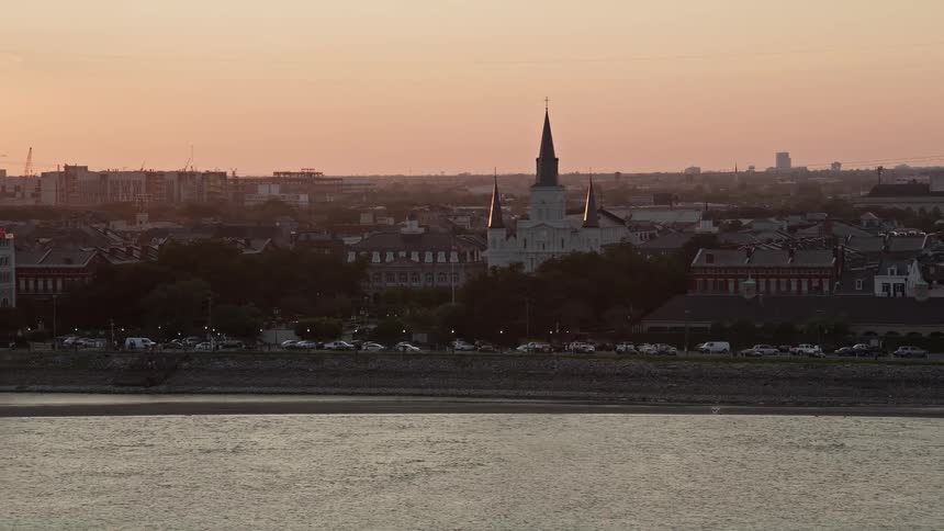 A church on a city street by a river
