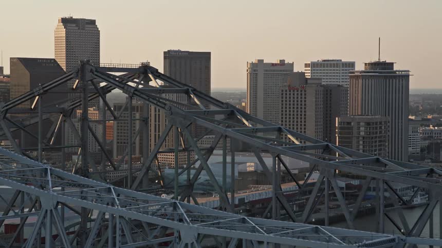 Aerial panorama of two bridges over the sea connecting the metropolis with the skyscraper in a morning