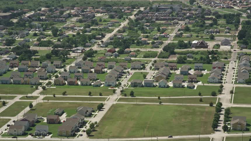 A suburban area with trees and roads