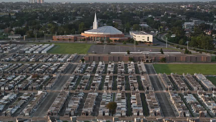 A church and large cemetery near a city