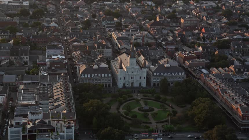 Aerial panorama of a church in front of a central park and in the middle of a residential city