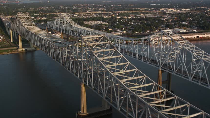 Aerial panorama of two bridges over the sea connecting urban cities