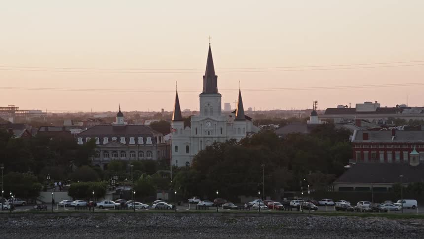 A church with a park sits near a waterfront