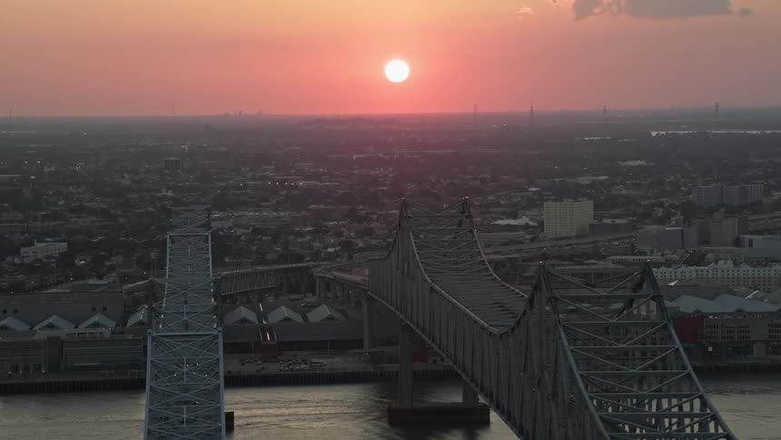 Aerial of an urban city bathed in sunlight during sunset