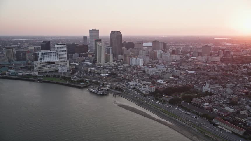 Tall buildings dominate a city with a waterfront