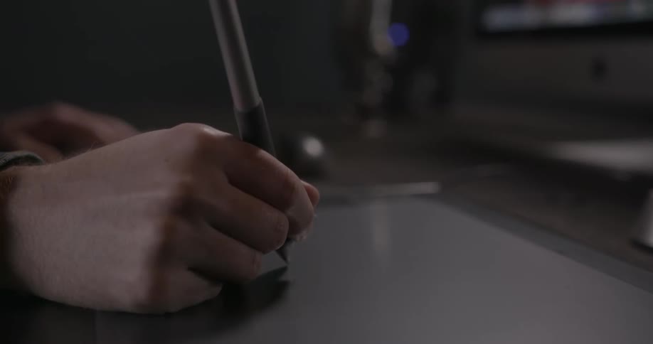 A person writes on a digital pad