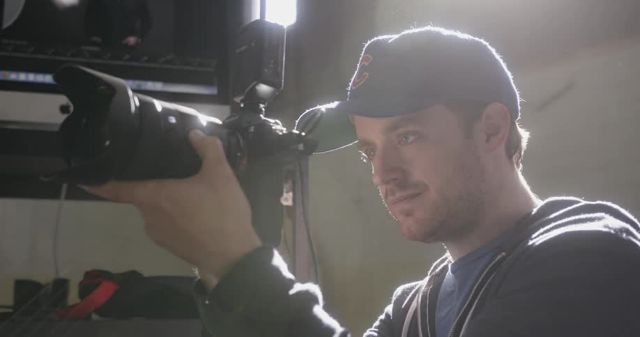 A photographer is taking pictures inside a building