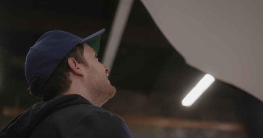 Man looking upward and smiling