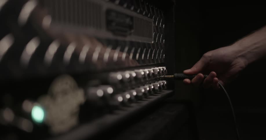 Person inserting a plug into a control board