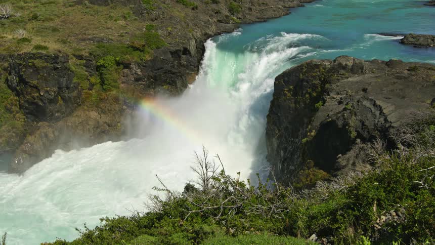 A rainbow is over the waterfall