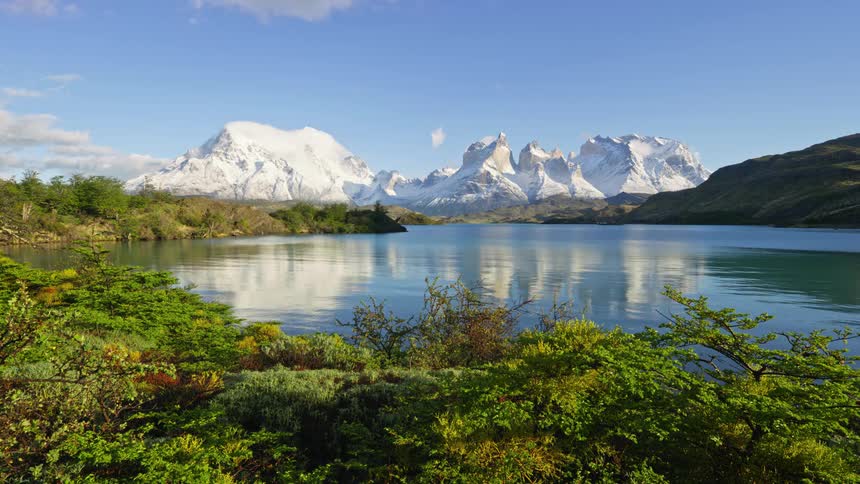 Snow covered mountains near a lake