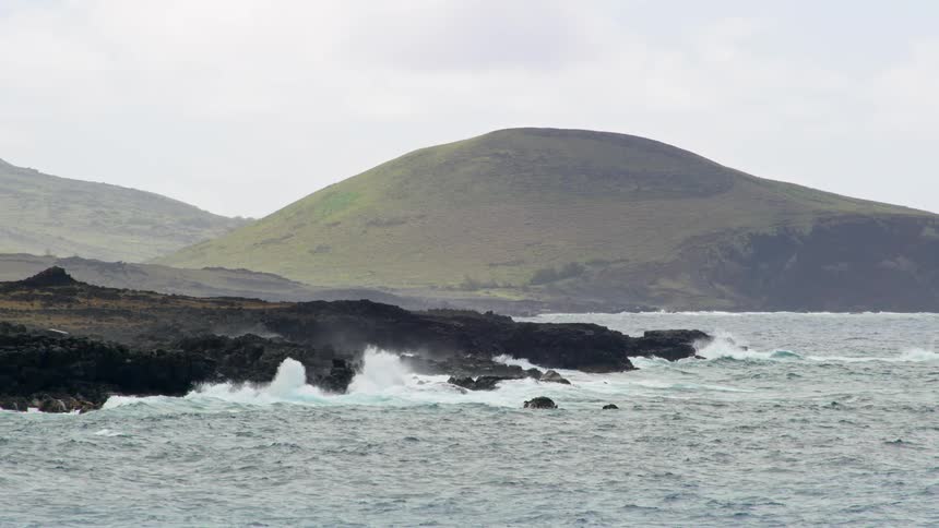Waves crash against a rocky coast