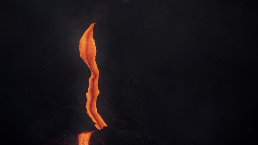 An orange glowing lava path descending over a mountain