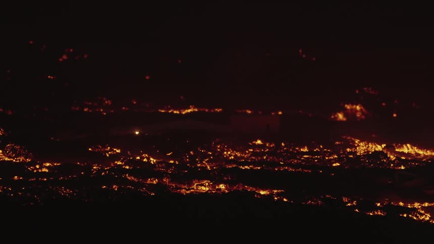 Lava from a volcano erupts causing destruction