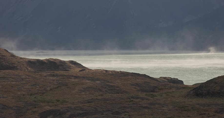 strong winds moving gusts of spray over a lake in Patagonia