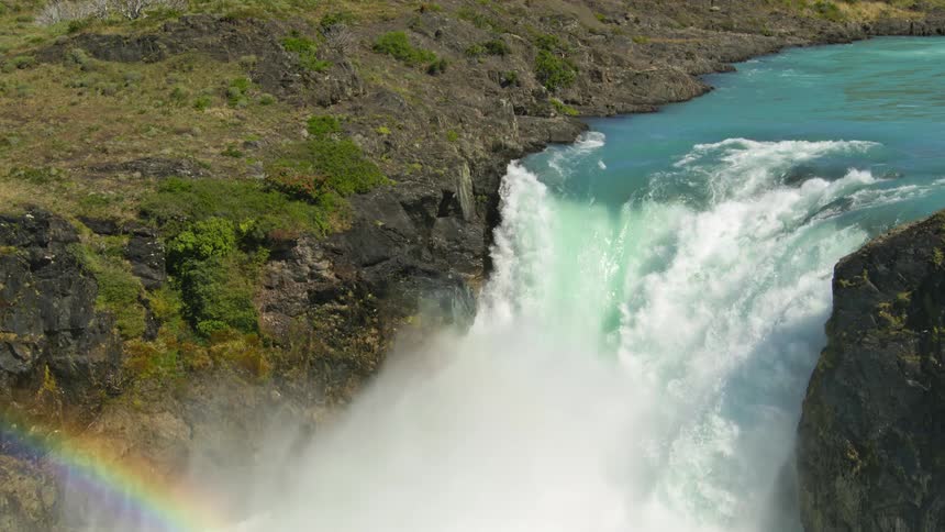 The raging waterfall falls off the cliff