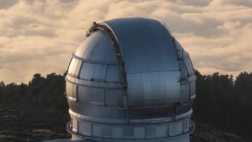 Aerial of an outdoor planetarium on a cloudy day